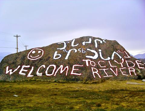 A dressed up rock welcoming visitors to Clyde River